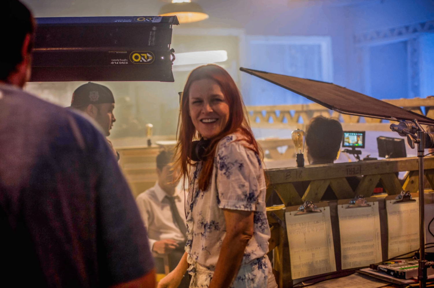 Anne Welles laughing on set during production
