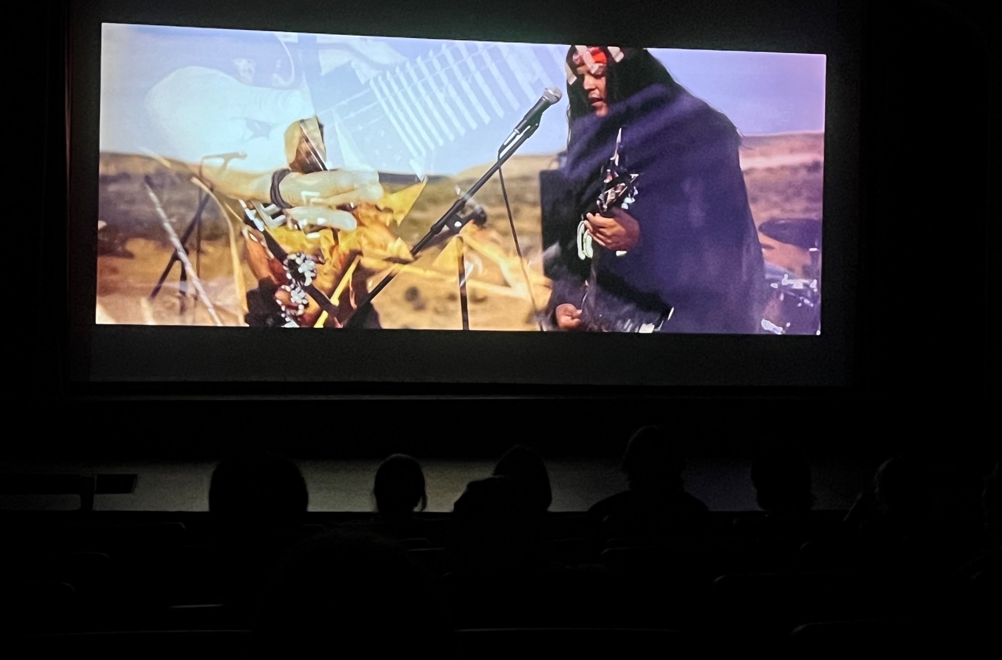 Music video screening — film on screen at venue