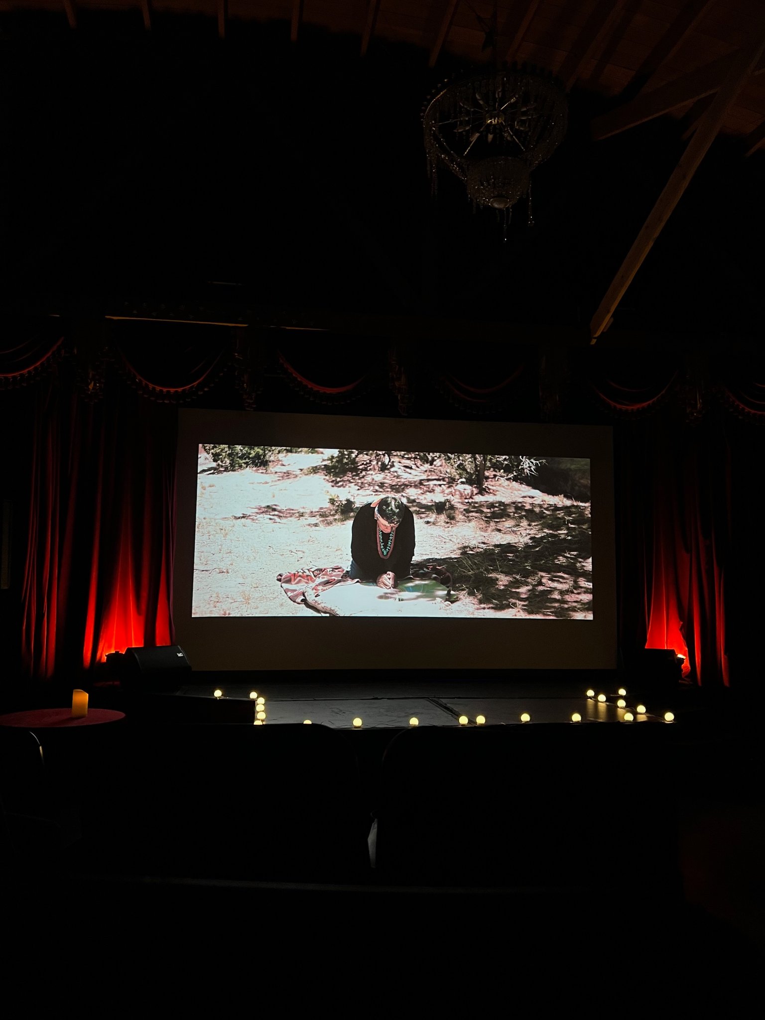Music video screening — film on screen at venue