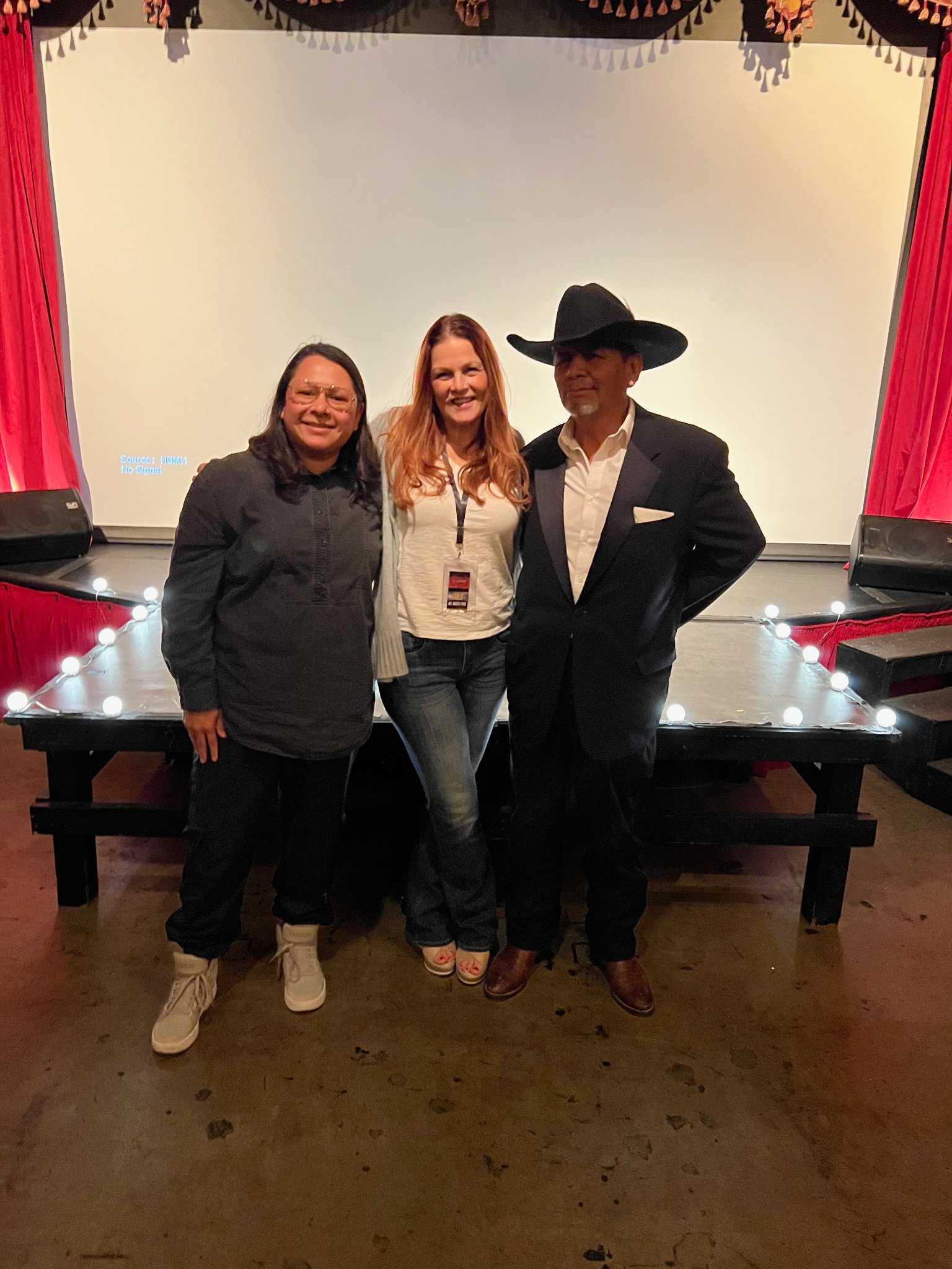 Anne Welles with band members at screening venue