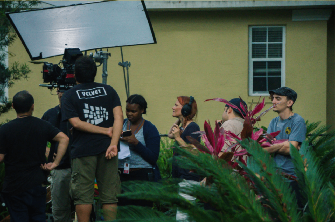 Crew gathered outside on location during production